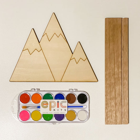 Epic kits explore play imagine create. Small world play, sensory play. Toddler play ideas. Natural eco-friendly play ideas. Sensory play kits. Sensory play ideas. Watercolour paint. Wooden toys. Snowy mountain woodlands Small world background. 